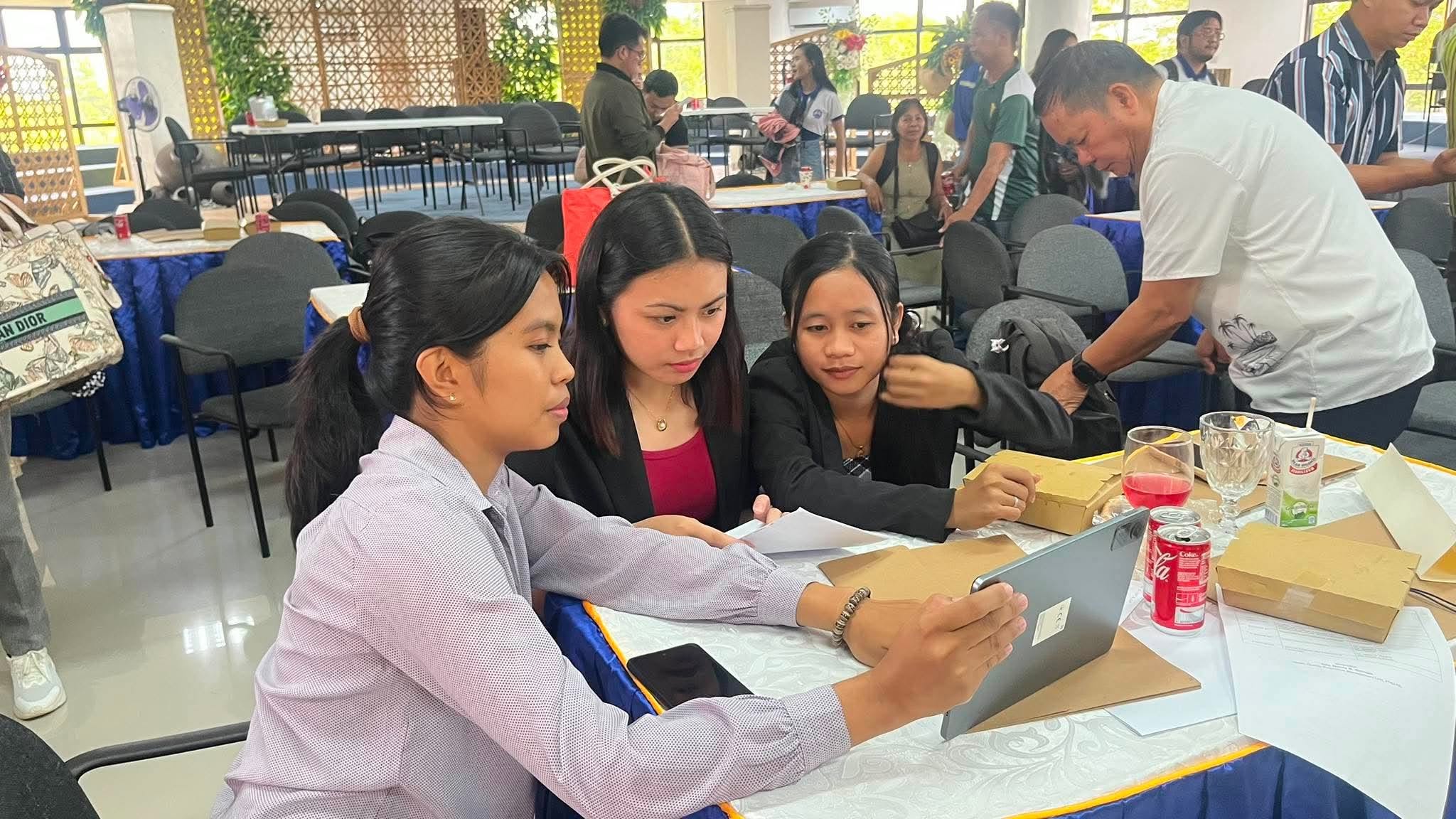 Participants engaged in hands-on data analytics and data presentation exercises using tablet computers and research materials