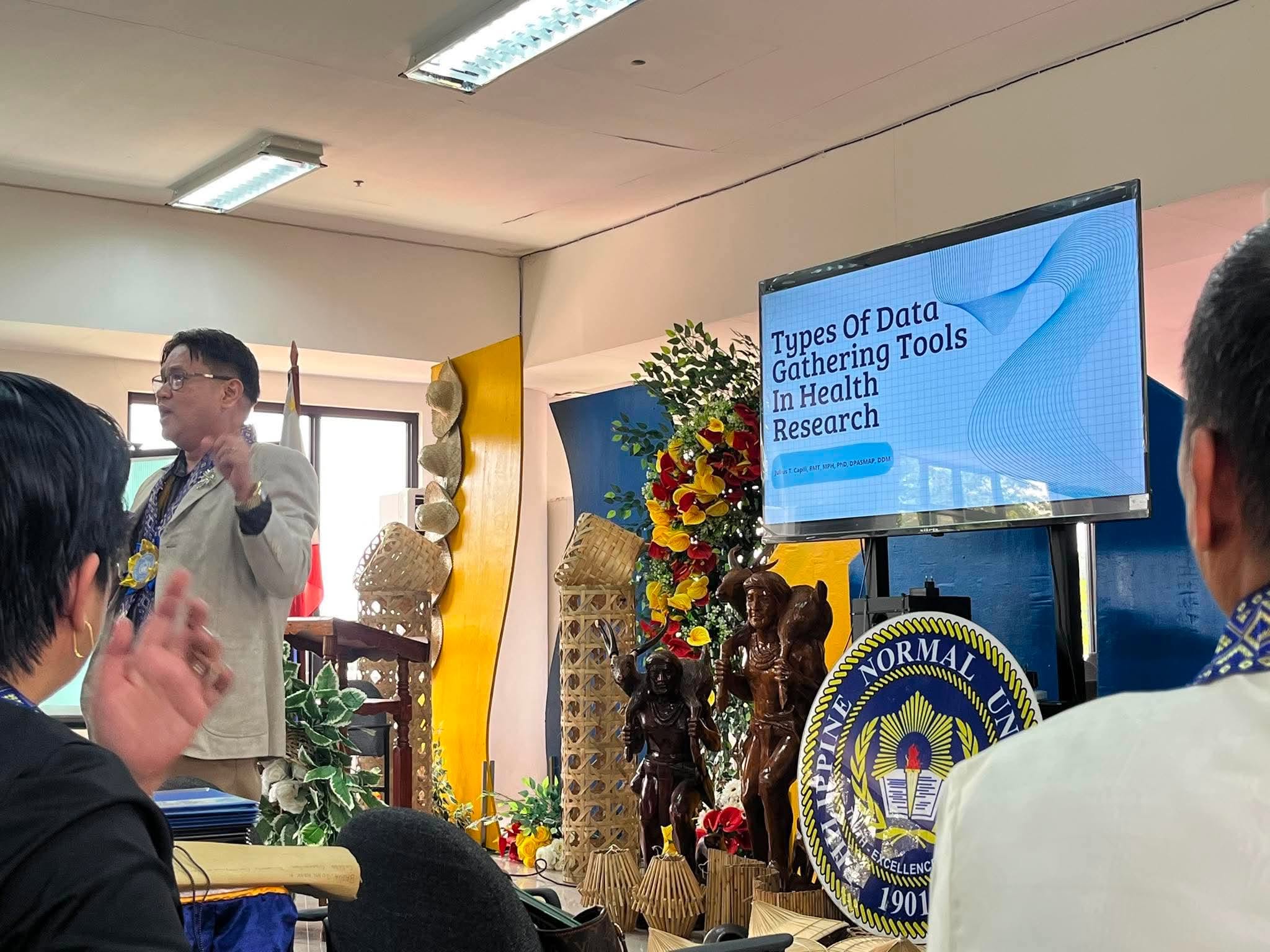 Resource speaker Dr. Julius T. Capili lecturing on Types of Data Gathering Tools in Health Research