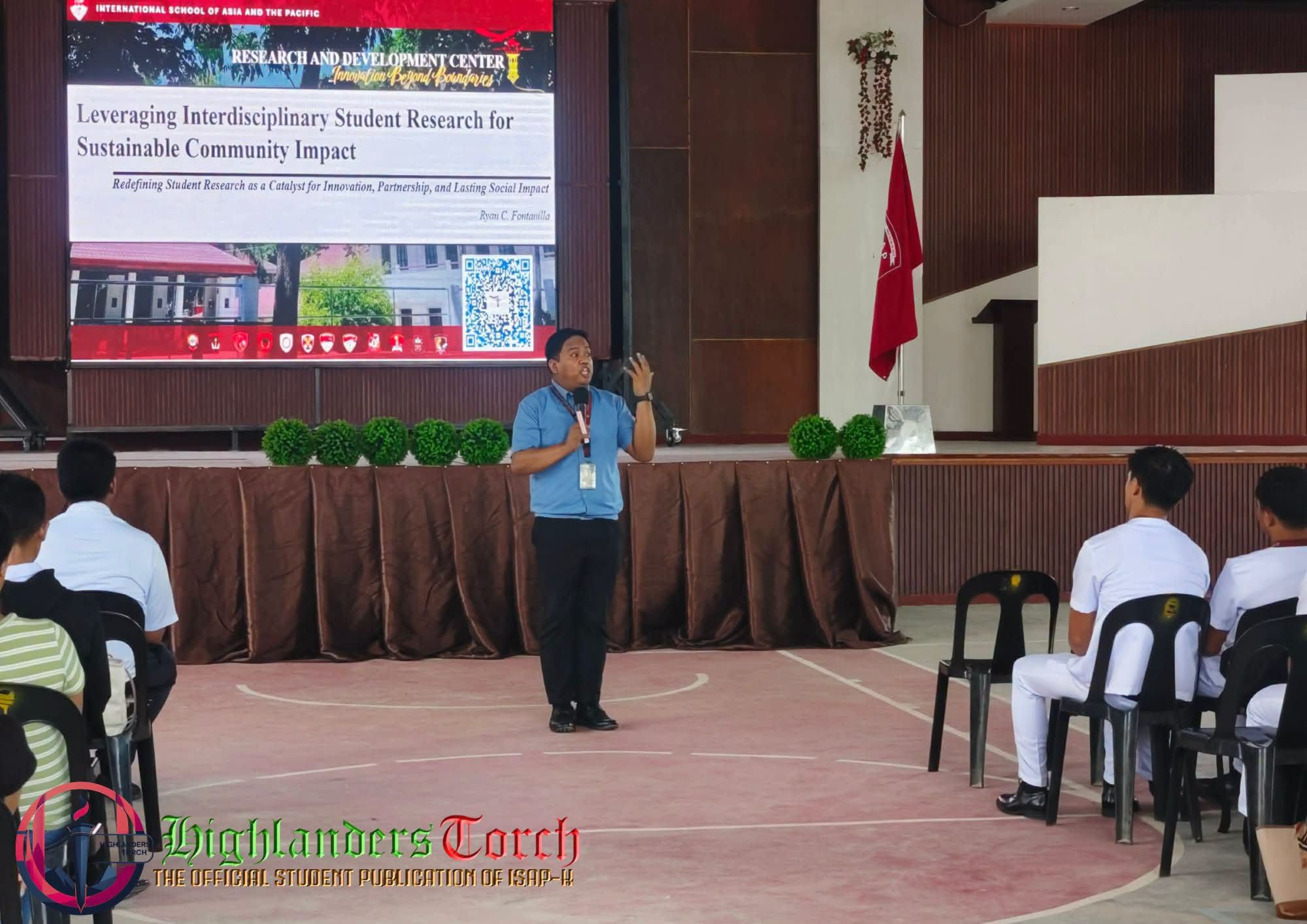Dr. Fontanilla presenting before student researchers at ISAP-Kalinga Gymnasium
