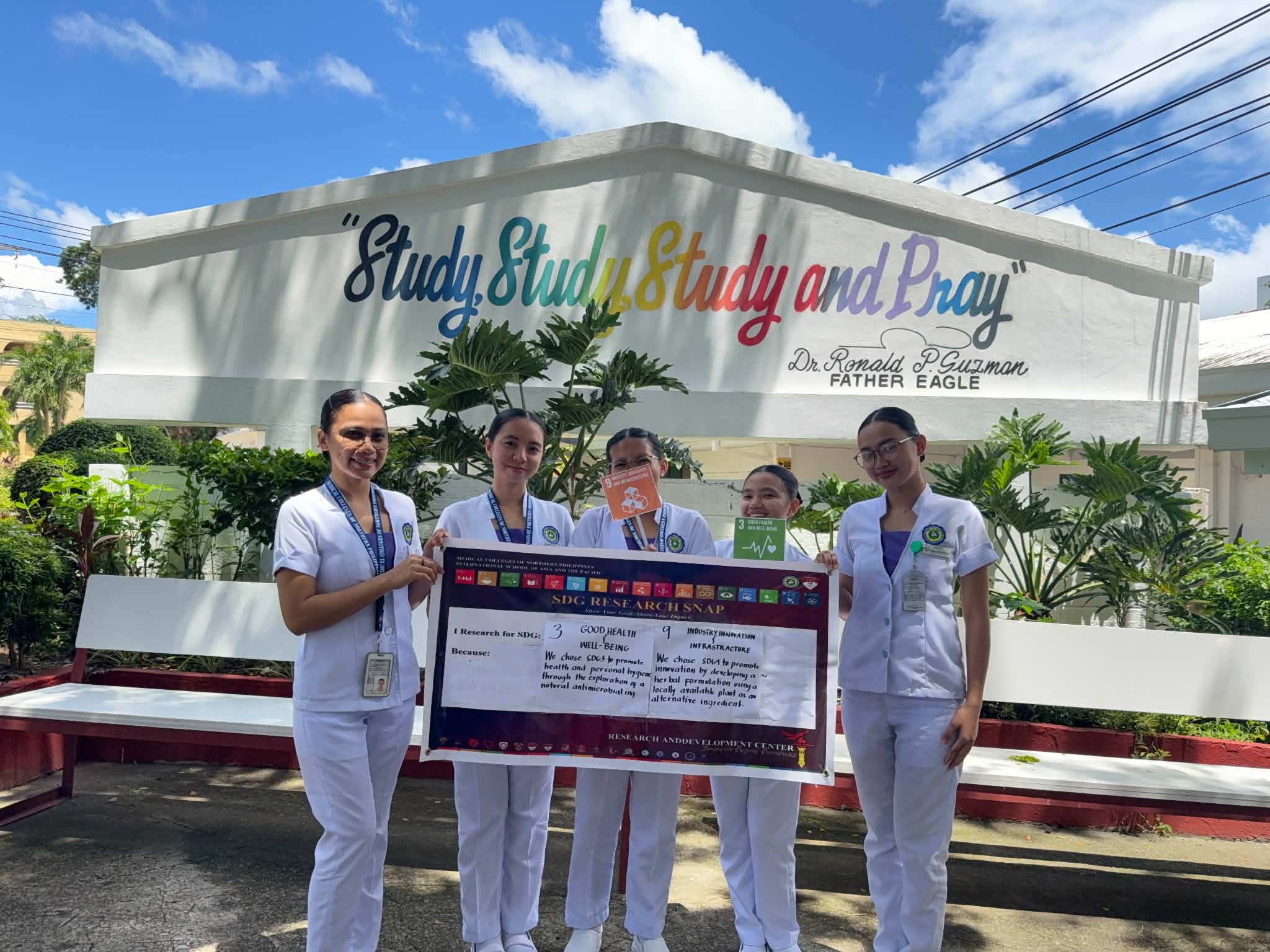 Pharmacy research team holding SDG 3 (Good Health) and SDG 9 (Innovation) research snap cards