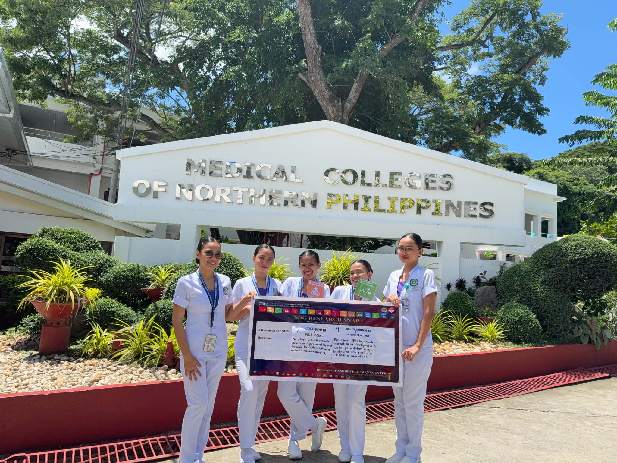 Student researchers at the MCNP building grounds during the Proposal Defense documentation