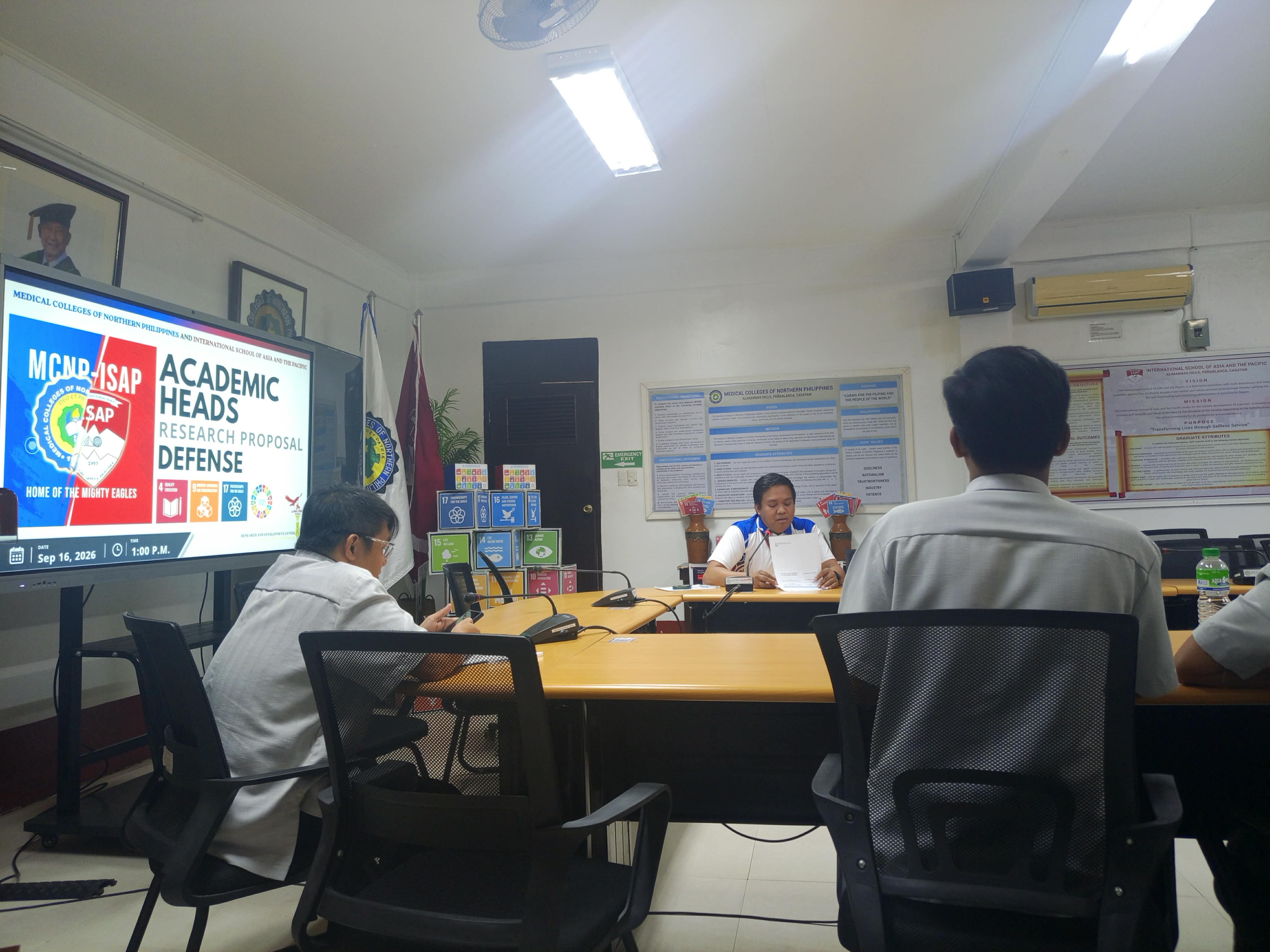 Academic Heads Research Proposal Defense in progress with digital screen date Sep 16, 2026