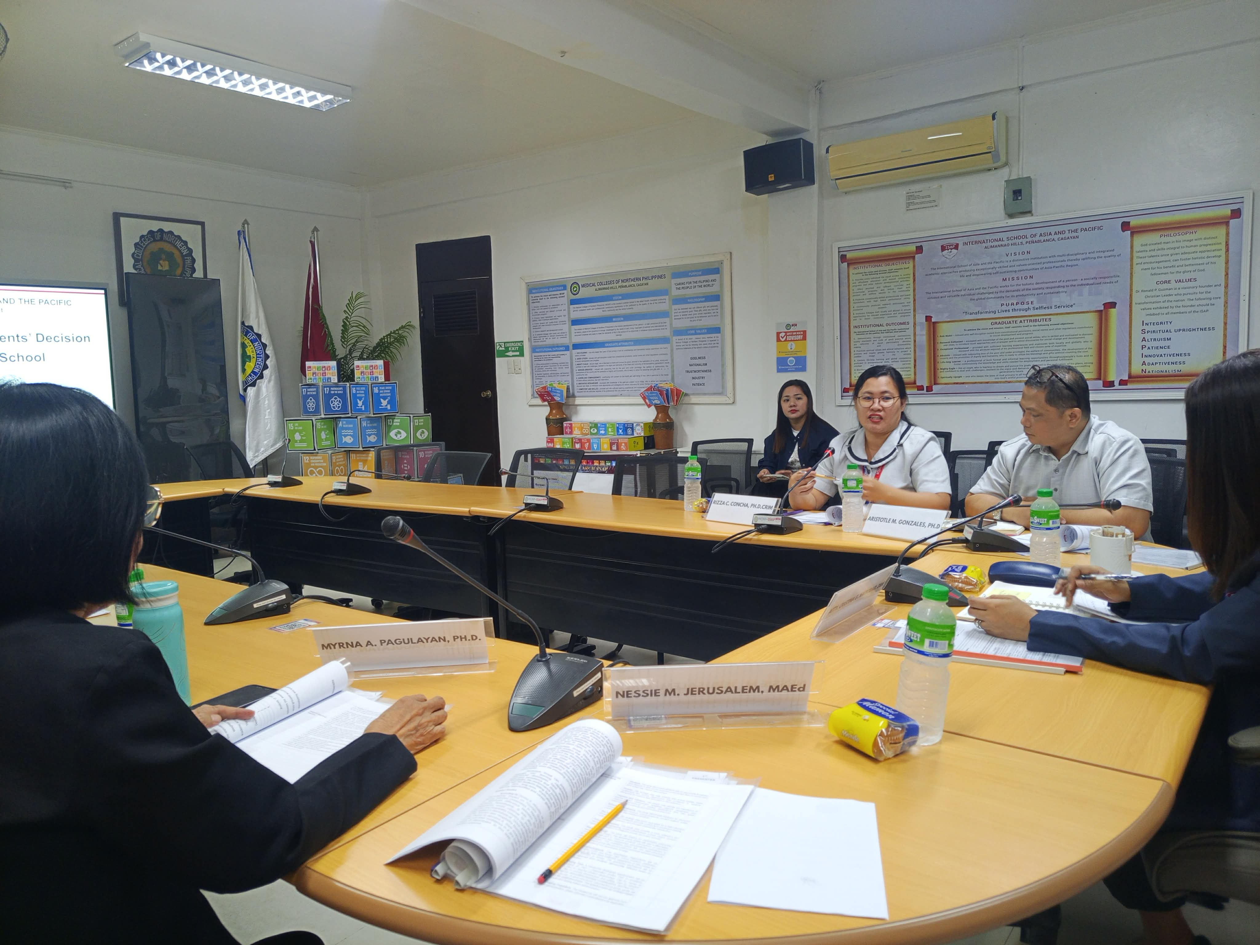 Research evaluators reviewing institutional proposal manuscripts and rubrics