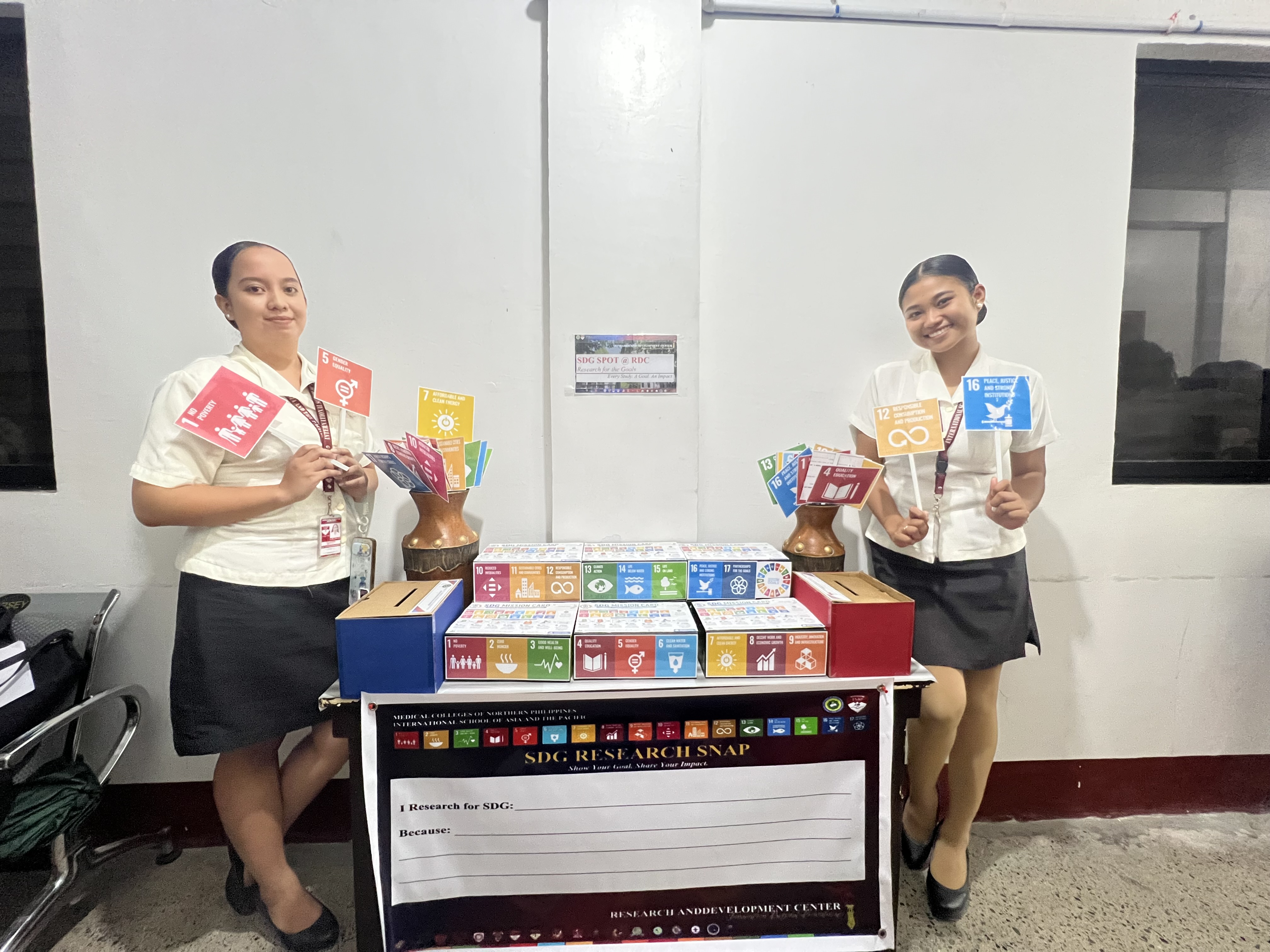 Students holding Sustainable Development Goals flags
