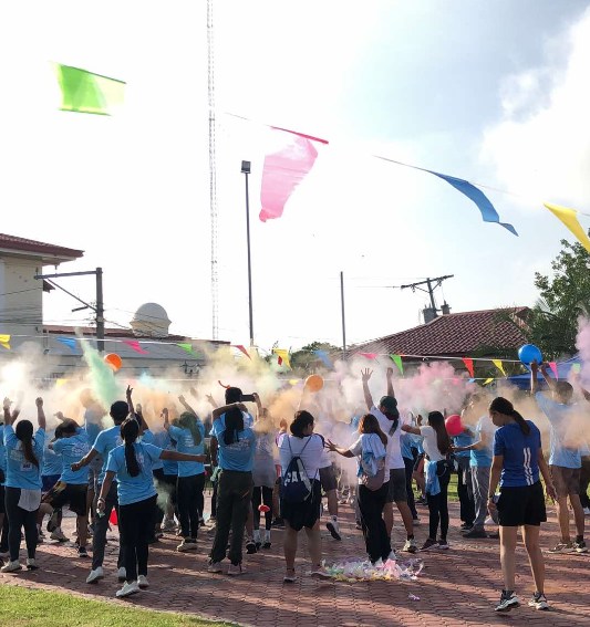 Color powder throw celebration with participants